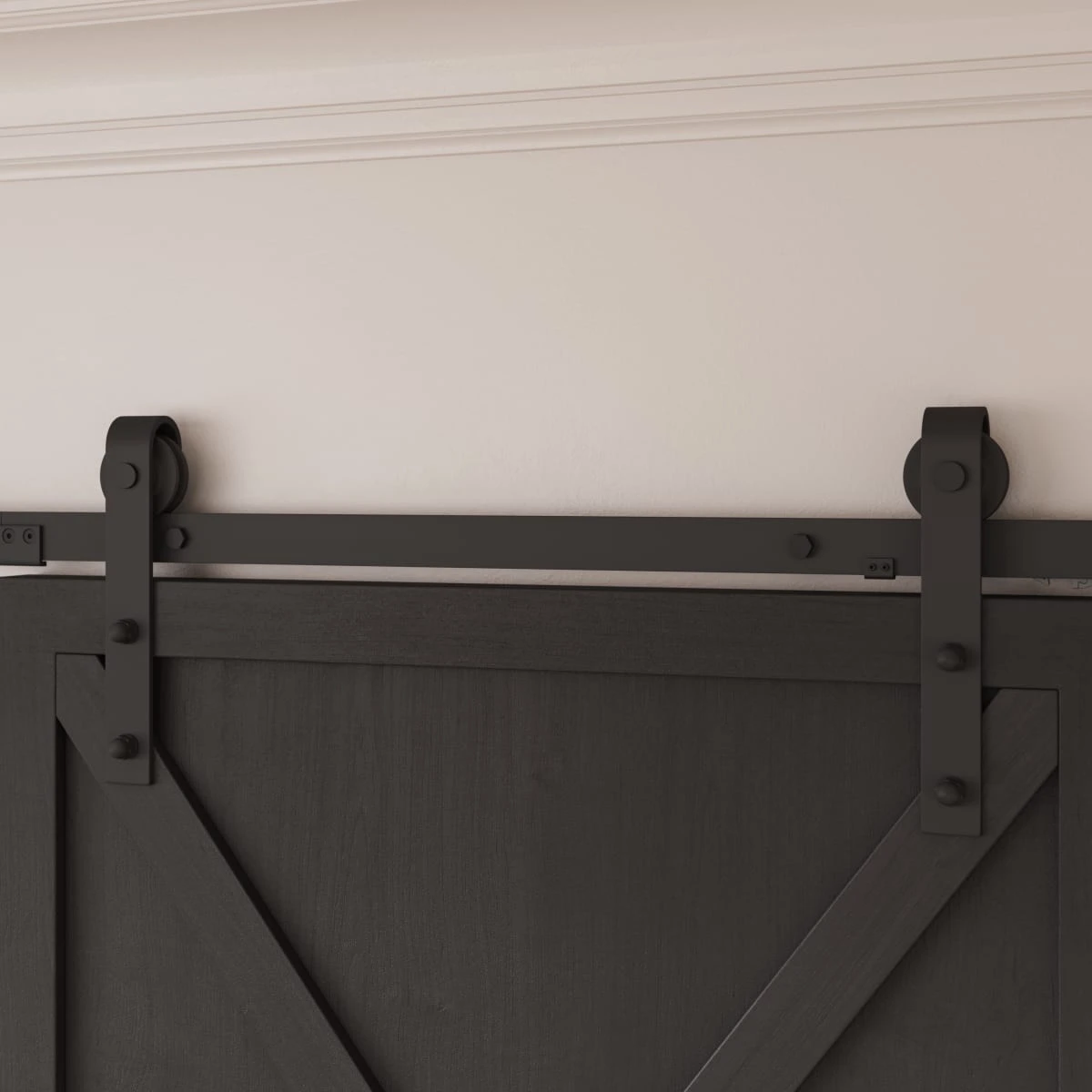 Black sliding-door rollers and rail above a dark paneled door